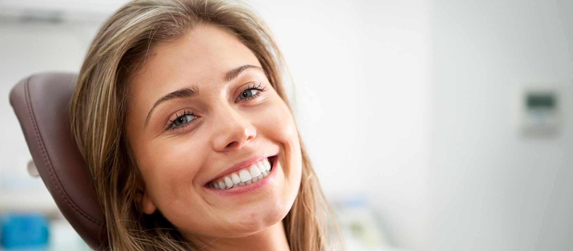 smiling woman sitting in a dental chair
